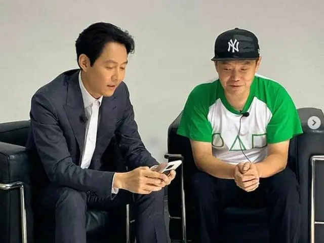TV Series ”Squid Game” starring _ actor Lee Jung Jae, studying how to take aselfie with a photograph